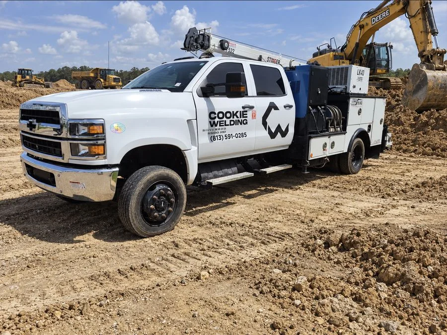 Cookie Welding mobile welding truck with crane and welder at a job site
